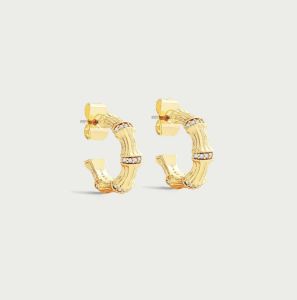 Bamboo Gold Huggie Hoop Earrings by Anabel Aram